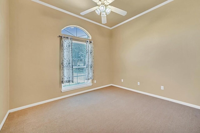 empty room featuring carpet, a wealth of natural light, crown molding, and ceiling fan