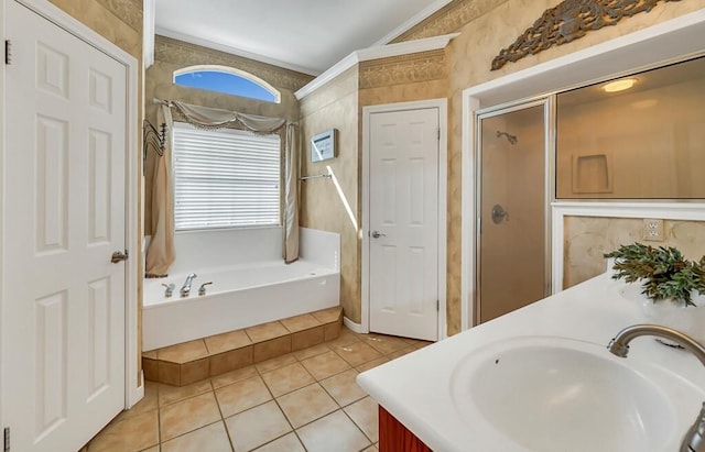 bathroom with tile patterned floors, vanity, crown molding, and shower with separate bathtub