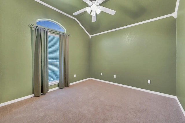 unfurnished room with light colored carpet, crown molding, plenty of natural light, and lofted ceiling