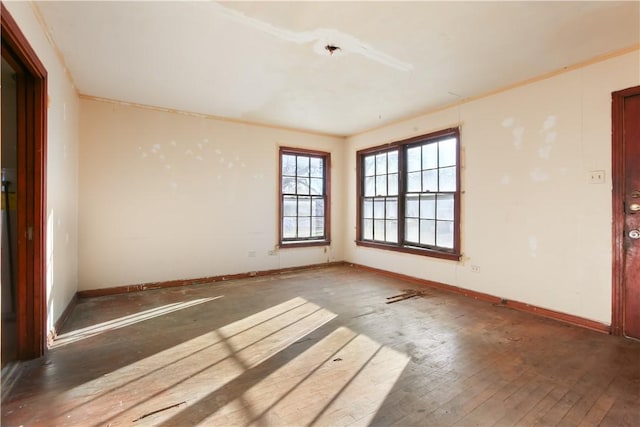 spare room featuring dark hardwood / wood-style flooring