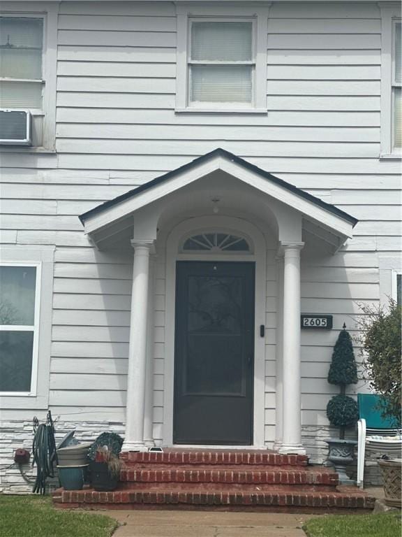 doorway to property with cooling unit