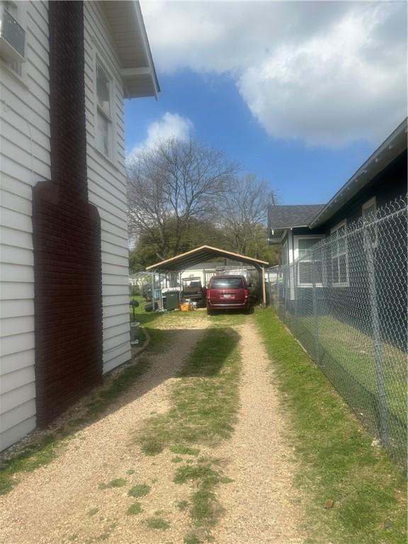 view of yard with a carport