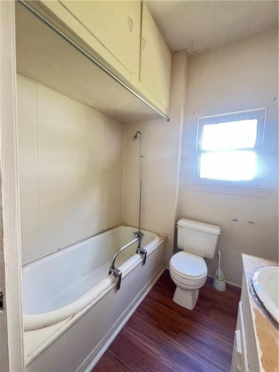 bathroom featuring hardwood / wood-style flooring, vanity, and toilet