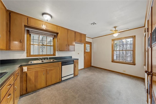 kitchen featuring white dishwasher, ceiling fan, ornamental molding, and sink