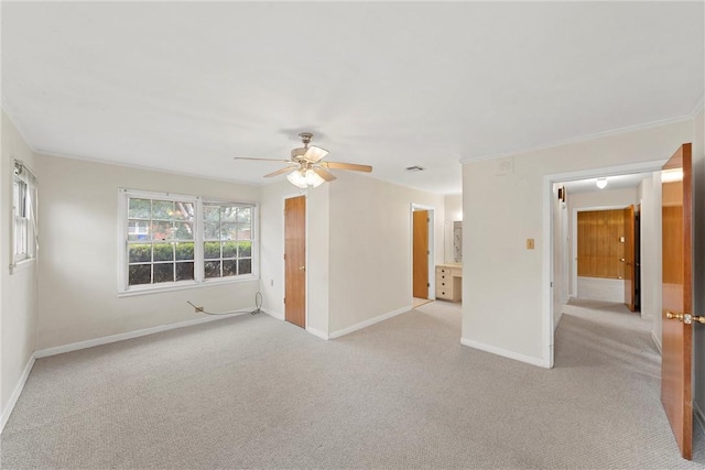 empty room featuring light carpet and ceiling fan