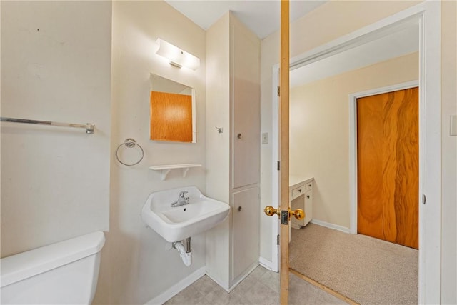 bathroom with toilet and sink