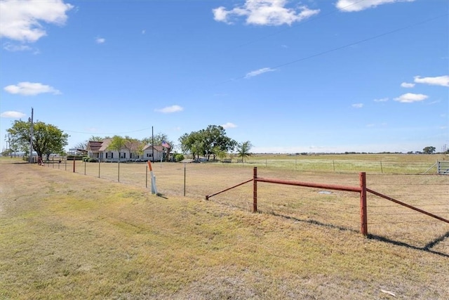 view of yard with a rural view