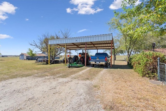 view of parking / parking lot featuring a carport