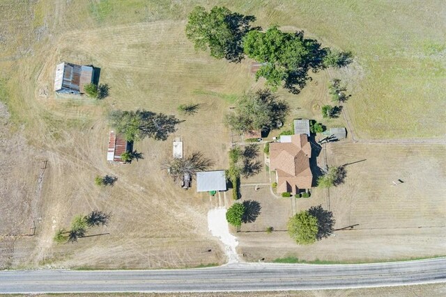 birds eye view of property with a rural view