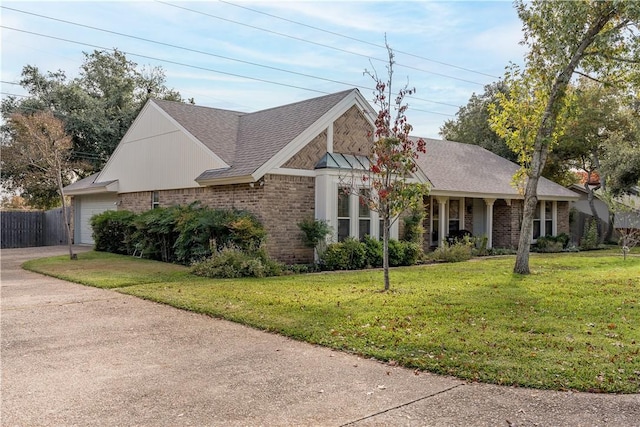 view of front of home with a garage and a front yard