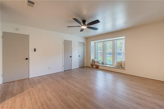 interior space with light wood-type flooring and ceiling fan