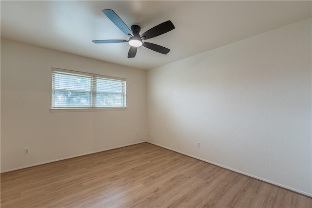 spare room featuring ceiling fan and light wood-type flooring