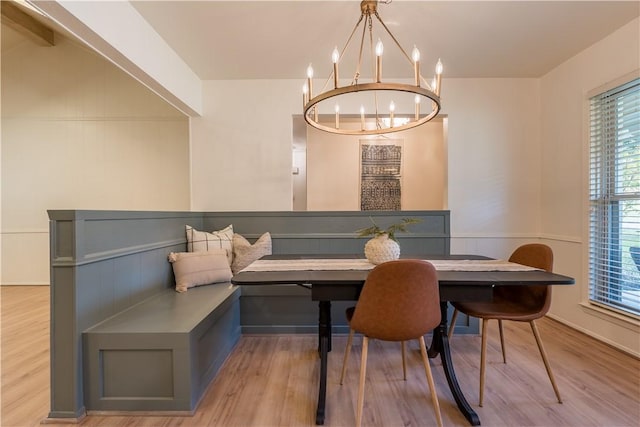 dining area with breakfast area, light hardwood / wood-style floors, and a wealth of natural light