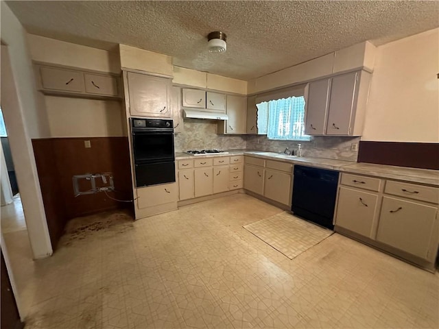 kitchen with white gas cooktop, backsplash, sink, black dishwasher, and a textured ceiling