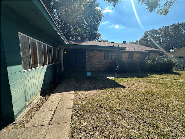 view of home's exterior featuring a yard