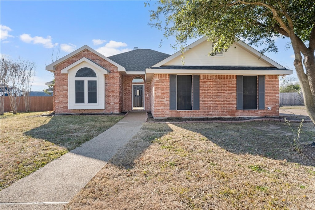 ranch-style house with a front lawn