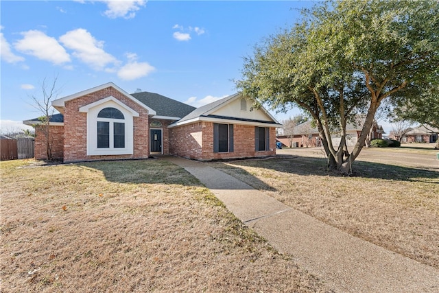 ranch-style home with a front lawn