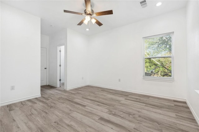 empty room featuring light hardwood / wood-style flooring and ceiling fan