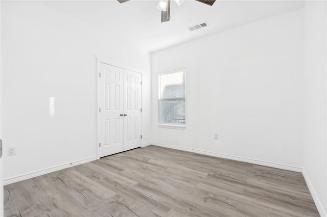 unfurnished room with light hardwood / wood-style floors and ceiling fan