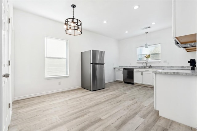 kitchen featuring white cabinetry, dishwasher, stainless steel fridge, decorative light fixtures, and light wood-type flooring