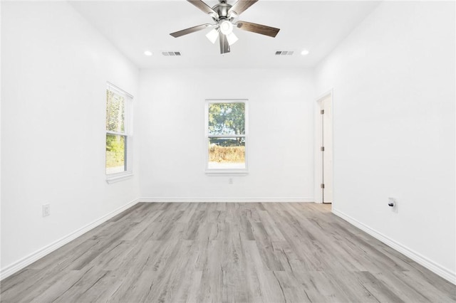 unfurnished room featuring ceiling fan and light wood-type flooring