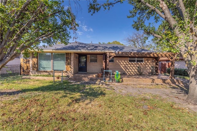 view of front of house with a patio area and a front yard