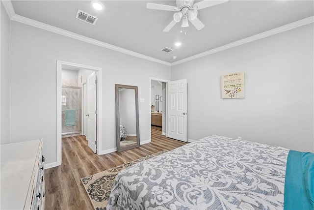 bedroom featuring ceiling fan, light hardwood / wood-style floors, ornamental molding, and ensuite bath