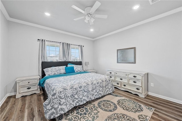 bedroom featuring ceiling fan, hardwood / wood-style floors, and ornamental molding