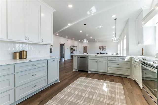 kitchen featuring kitchen peninsula, appliances with stainless steel finishes, decorative light fixtures, dark hardwood / wood-style flooring, and white cabinetry