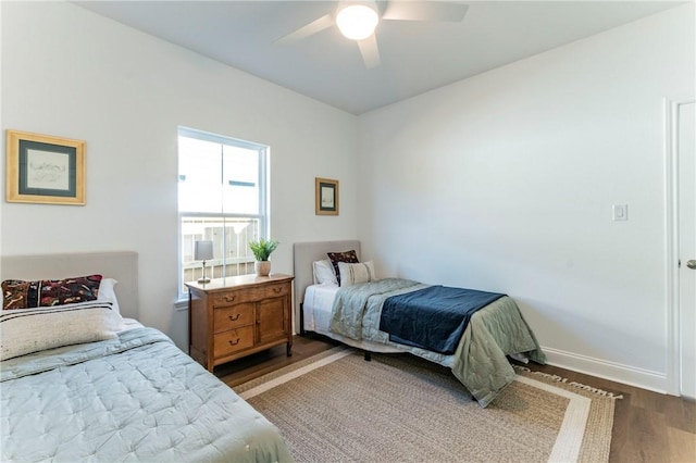 bedroom with hardwood / wood-style flooring and ceiling fan