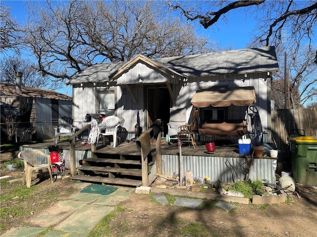 view of front of house with an outbuilding and a wooden deck