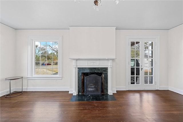 unfurnished living room featuring dark hardwood / wood-style floors and a wealth of natural light