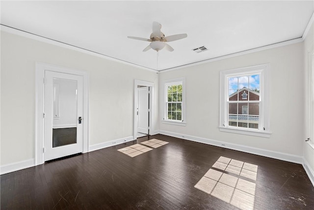 empty room featuring crown molding, ceiling fan, and dark wood-type flooring