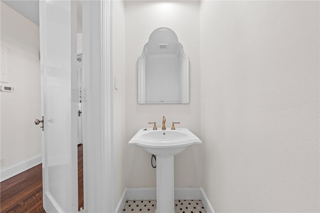 bathroom featuring wood-type flooring