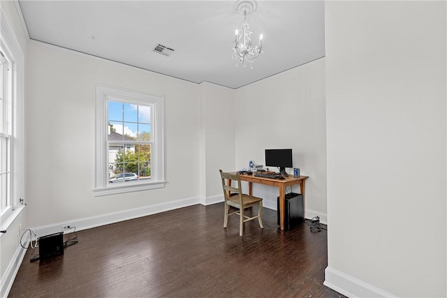 office area with dark hardwood / wood-style floors and an inviting chandelier