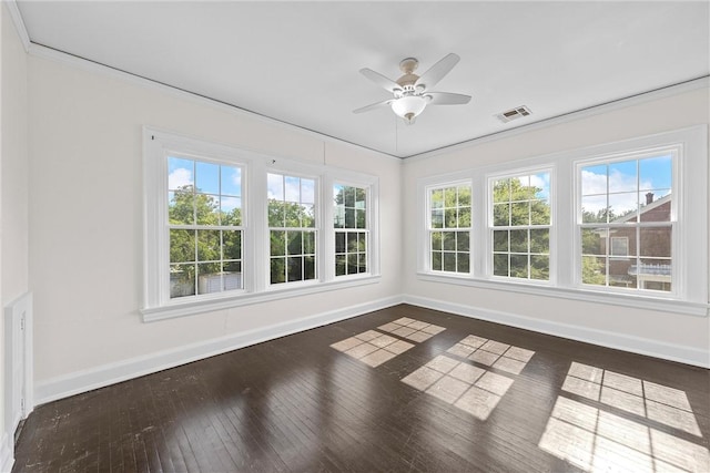 unfurnished sunroom with a wealth of natural light and ceiling fan