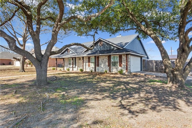 ranch-style house featuring a garage