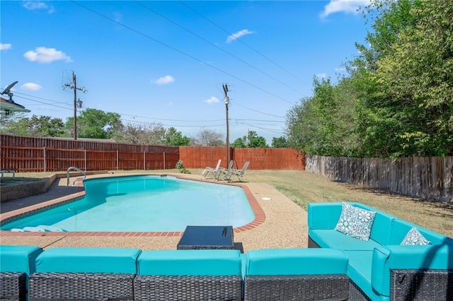 view of pool with a yard