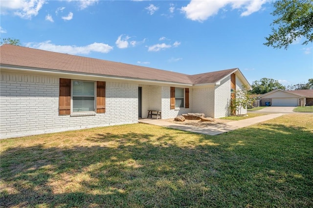 view of front of house with a garage and a front lawn