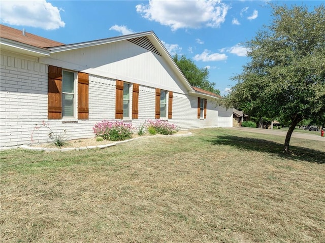 view of property exterior featuring a yard