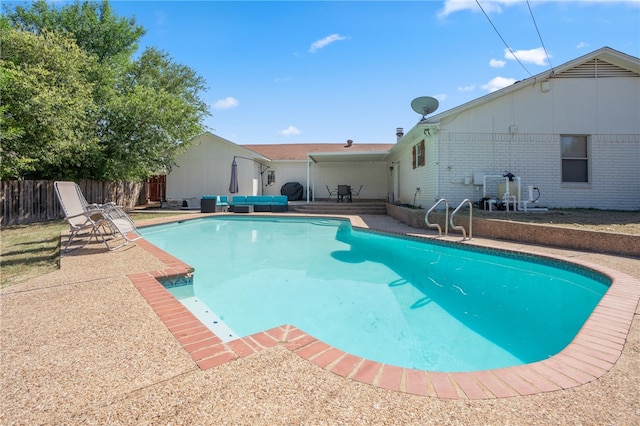 view of swimming pool featuring a patio