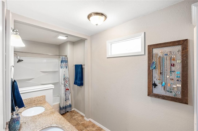 bathroom with vanity and shower / bath combo with shower curtain