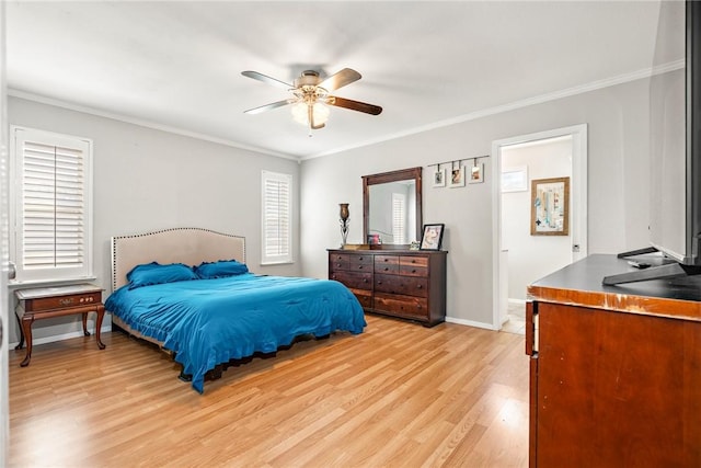 bedroom featuring multiple windows, light wood-type flooring, ceiling fan, and ornamental molding