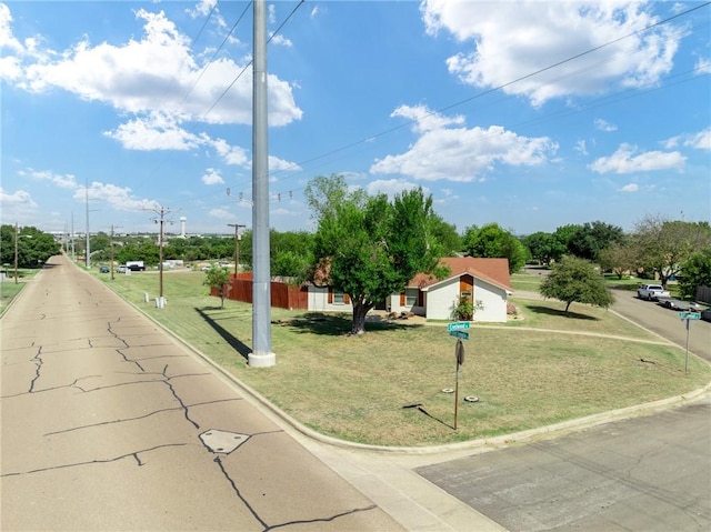 view of property's community with a yard