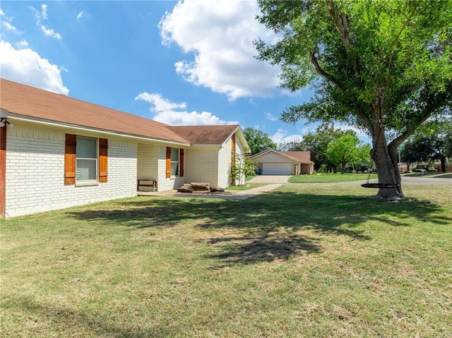 view of yard featuring a garage