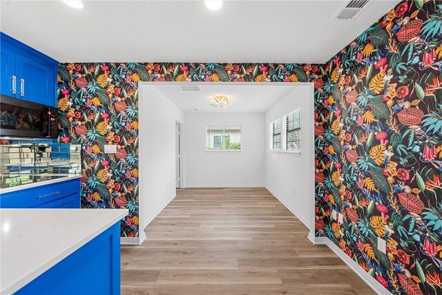 unfurnished dining area with light hardwood / wood-style floors