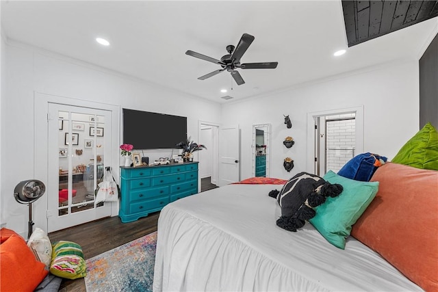 bedroom featuring dark hardwood / wood-style flooring, ceiling fan, and ornamental molding