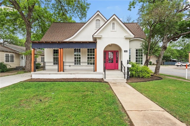 view of front facade with covered porch and a front lawn