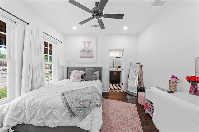 bedroom featuring ensuite bathroom, ceiling fan, dark hardwood / wood-style flooring, and ornamental molding