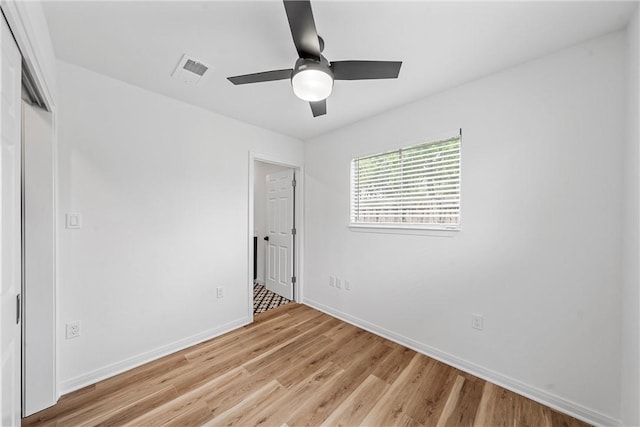 unfurnished bedroom featuring ceiling fan and light wood-type flooring